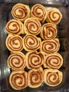 Cinnamon roll dough cut into 1 inch rolls and in a 9x13 baking dish